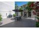 Patio with table, chairs, umbrella, and grill, perfect for outdoor entertaining and relaxing at 3325 Bayshore Blvd # A17, Tampa, FL 33629