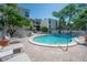 Outdoor pool with a 3 foot depth surrounded by brick pavers and lush landscaping at 3325 Bayshore Blvd # A17, Tampa, FL 33629