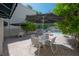 Outdoor community pool area with multiple tables, chairs and umbrellas on a brick patio at 3325 Bayshore Blvd # A17, Tampa, FL 33629