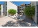 Community pool deck with lounge chairs and greenery with a multi-story condo building in the background at 3325 Bayshore Blvd # A17, Tampa, FL 33629
