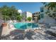 Community pool with an 8 foot depth surrounded by brick pavers and lush landscaping at 3325 Bayshore Blvd # A17, Tampa, FL 33629