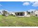 Expansive backyard featuring a screened porch with beautiful green space at 4325 93Rd N Ter, Pinellas Park, FL 33782