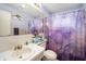 Bathroom with marble design shower curtain and neutral-colored towels at 4325 93Rd N Ter, Pinellas Park, FL 33782