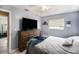 Comfortable bedroom featuring a large dresser and closet for ample storage at 4325 93Rd N Ter, Pinellas Park, FL 33782