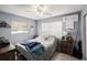 Cozy bedroom with neutral walls, ceiling fan and window for natural light at 4325 93Rd N Ter, Pinellas Park, FL 33782