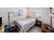 Bedroom with a comfortable bed and side table and natural light from window at 4325 93Rd N Ter, Pinellas Park, FL 33782