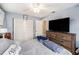 Comfortable bedroom featuring a large dresser and closet for ample storage at 4325 93Rd N Ter, Pinellas Park, FL 33782