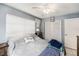 Cozy bedroom with neutral walls, ceiling fan and window for natural light at 4325 93Rd N Ter, Pinellas Park, FL 33782