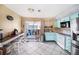 Bright eat-in kitchen featuring stainless appliances and sliding glass doors to screened lanai at 4325 93Rd N Ter, Pinellas Park, FL 33782