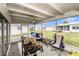 Relaxing screened porch with ceiling fan, ideal for grilling and outdoor entertainment at 4325 93Rd N Ter, Pinellas Park, FL 33782
