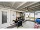 Well-appointed screened porch featuring a grill for outdoor cooking and relaxation at 4325 93Rd N Ter, Pinellas Park, FL 33782