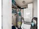 Efficient utility closet with a stacked washer/dryer and a newer hot water tank, plus some shelving at 4325 93Rd N Ter, Pinellas Park, FL 33782