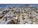 A picturesque aerial view of a charming neighborhood near the water, with a cozy home marked by an arrow at 434 77Th Ave, St Pete Beach, FL 33706