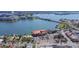 Beautiful aerial view of city waterways, a bridge, a hotel, and nearby buildings and businesses at 434 77Th Ave, St Pete Beach, FL 33706