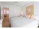 Bright bedroom with light walls, ceiling fan, wood floors, and natural light, offering a comfortable retreat at 434 77Th Ave, St Pete Beach, FL 33706