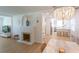 Light-filled living room features a stone fireplace, hardwood floors, and an open concept design at 434 77Th Ave, St Pete Beach, FL 33706