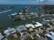 Stunning aerial view of waterfront homes, showcasing a prime real estate community with boat docks and scenic waterways at 4545 Clearwater Harbor N Dr, Largo, FL 33770