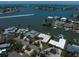 Waterfront neighborhood aerial showcasing luxury homes and waterways with boat in view at 4545 Clearwater Harbor N Dr, Largo, FL 33770