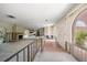 Hallway with fireplace, arches, and stairs leading to other living areas; ready for renovation at 4545 Clearwater Harbor N Dr, Largo, FL 33770