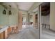 Hallway showing a closet, bathroom, and striped wallpaper ready for renovation at 4545 Clearwater Harbor N Dr, Largo, FL 33770