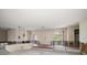 Living room featuring arched windows and double doors accessing the front balcony at 4545 Clearwater Harbor N Dr, Largo, FL 33770