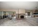 Living room with a fireplace and sliding glass doors offering natural light and outdoor views at 4545 Clearwater Harbor N Dr, Largo, FL 33770