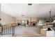 Open concept living room ready for remodel, featuring a fireplace and large window offering natural light at 4545 Clearwater Harbor N Dr, Largo, FL 33770