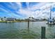 Waterfront property featuring a peaceful canal and scenic landscaping at 4545 Clearwater Harbor N Dr, Largo, FL 33770
