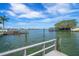 Beautiful waterfront view from the pier with palm trees and blue skies at 4545 Clearwater Harbor N Dr, Largo, FL 33770