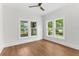 A sun filled bedroom with multiple windows and vinyl wood floors is move in ready at 459 Bell Ave, Brooksville, FL 34601