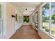 Charming screened porch with wood floors offers relaxing outdoor living space at 459 Bell Ave, Brooksville, FL 34601