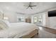 Bright bedroom features a vaulted ceiling, king bed, hardwood floors, and patio access at 460 Althea Rd, Belleair, FL 33756