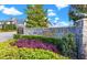 Elegant stone entrance to a private club featuring beautiful landscaping at 460 Althea Rd, Belleair, FL 33756
