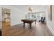 Bright game room featuring a pool table, hardwood floors, modern lighting, and views to the outside at 460 Althea Rd, Belleair, FL 33756