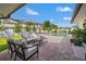 Inviting outdoor patio area with comfortable seating, perfect for relaxing by the pool at 460 Althea Rd, Belleair, FL 33756