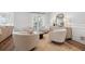 Bright sitting area features four armchairs and a coffee table at 460 Althea Rd, Belleair, FL 33756