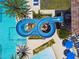 Aerial view of community pool and water slide at 4653 Ancona Way, Wesley Chapel, FL 33543