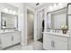 Dual vanity in the Primary bath with matching mirrors at 4653 Ancona Way, Wesley Chapel, FL 33543