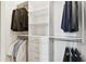 Spacious walk-in closet featuring custom shelving and ample storage for clothing and accessories at 4653 Ancona Way, Wesley Chapel, FL 33543