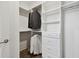 Spacious walk-in closet with custom shelving and ample storage space for clothes and accessories at 4653 Ancona Way, Wesley Chapel, FL 33543
