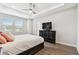 Spacious bedroom with wood floors and black dresser at 4653 Ancona Way, Wesley Chapel, FL 33543