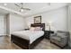 This bedroom offers a trey ceiling, wood flooring, and decor at 4653 Ancona Way, Wesley Chapel, FL 33543