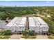 An eye-level aerial view of the community highlighting manicured landscaping and nearby trees at 5008 S Macdill Ave # 16, Tampa, FL 33611