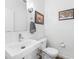Bathroom features a modern sink, toilet, and artwork at 5008 S Macdill Ave # 16, Tampa, FL 33611