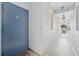 Hallway shows the entrance to unit #16, with a view towards a balcony and natural light at 5008 S Macdill Ave # 16, Tampa, FL 33611