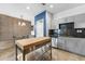 Kitchen with stainless steel appliances, butcher block island, modern cabinets, and dining area at 5008 S Macdill Ave # 16, Tampa, FL 33611