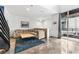 Cozy living room featuring a plush sofa, area rug, and access to an outdoor balcony at 5008 S Macdill Ave # 16, Tampa, FL 33611