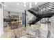 Open living space with a modern staircase, polished concrete floors, and an open kitchen concept at 5008 S Macdill Ave # 16, Tampa, FL 33611