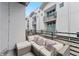 A covered outdoor patio is furnished with an outdoor seating area and neighborhood views at 5008 S Macdill Ave # 16, Tampa, FL 33611
