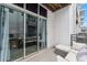 Balcony view with comfy seating outside the sliding glass doors, providing a relaxing outdoor space at 5008 S Macdill Ave # 16, Tampa, FL 33611